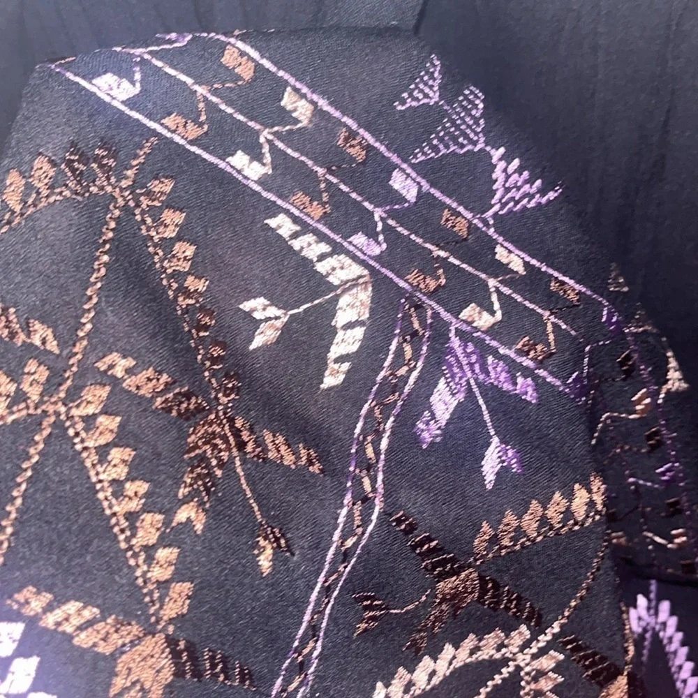 Free People black mini dress size XS with back tie and deep V bk w/ embroidery